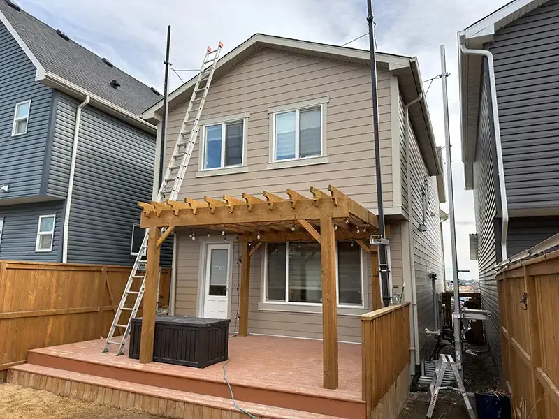 Dedicated Roofing team member working on a rooftop in Calgary.