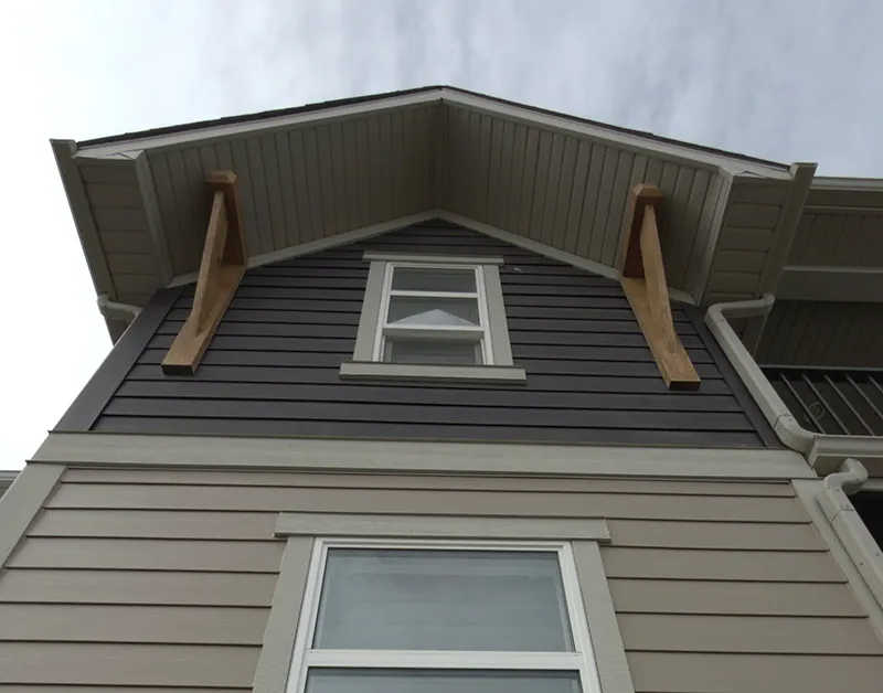 Dedicated Roofing team member working on a rooftop in Calgary.